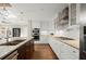 Kitchen featuring granite countertops, stainless steel appliances, and kitchen island with barstool seating at 495 Heritage Way, Atlanta, GA 30328