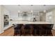 Kitchen featuring granite countertops, stainless steel appliances, and island with seating at 495 Heritage Way, Atlanta, GA 30328