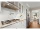 Kitchen featuring white cabinets, granite countertops, stainless steel appliances, and white subway tile backsplash at 495 Heritage Way, Atlanta, GA 30328