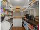 Walk-in pantry with storage shelves and counter space at 495 Heritage Way, Atlanta, GA 30328