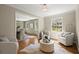 A cozy sitting area with hardwood floors, natural light, and comfortable seating at 495 Heritage Way, Atlanta, GA 30328