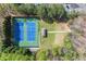 Aerial view of community tennis courts in a wooded area at 495 Heritage Way, Atlanta, GA 30328