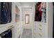 Spacious walk-in closet featuring custom built-ins and shelving for optimal storage at 495 Heritage Way, Atlanta, GA 30328