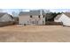 Two-story home with large backyard, fenced for privacy, offering a serene outdoor space at 923 Port West Dr, Auburn, GA 30011
