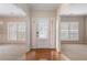 Welcoming foyer with hardwood floors and an abundance of natural light from large windows at 923 Port West Dr, Auburn, GA 30011
