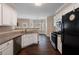 Spacious kitchen with granite countertops, stainless steel appliances, and a view of the breakfast nook at 923 Port West Dr, Auburn, GA 30011