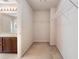 Empty walk-in closet with wire shelving and neutral carpeting shows room for storage at 923 Port West Dr, Auburn, GA 30011