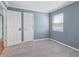 Serene bedroom shows a window, two doors, freshly painted walls and plush carpeting, promising relaxation at 1531 Stone Gate Se Ln, Atlanta, GA 30317