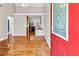 Open-concept living room with hardwood floors and views into the kitchen through the doorway at 1531 Stone Gate Se Ln, Atlanta, GA 30317