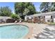 Inviting community pool with shallow end steps and ample seating for relaxation at 1531 Stone Gate Se Ln, Atlanta, GA 30317