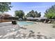 Community pool surrounded by manicured hedges and trees, complete with sun loungers for relaxing poolside at 1531 Stone Gate Se Ln, Atlanta, GA 30317
