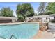 Relaxing community pool area featuring stone accents and lounge chairs at 1531 Stone Gate Se Ln, Atlanta, GA 30317