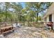 Large wooden deck with a picnic table, grill, and wooded backdrop, ideal for outdoor gatherings at 419 Fincher Rd, Covington, GA 30016