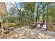 Spacious wooden back deck with outdoor seating offering a relaxing view of the wooded backyard at 419 Fincher Rd, Covington, GA 30016