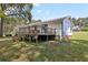 The back exterior of the house features a deck and a white exterior at 419 Fincher Rd, Covington, GA 30016
