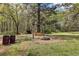 Spacious backyard featuring a wooden swing set and firepit at 419 Fincher Rd, Covington, GA 30016