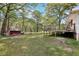 The large backyard features a shed and back deck, providing lots of room for activities at 419 Fincher Rd, Covington, GA 30016