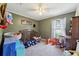 Bedroom with soft gray carpet, ample natural light and room for play at 419 Fincher Rd, Covington, GA 30016