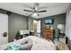 Bedroom with ceiling fan, TV, dresser, and neutral wall color creating a serene space at 419 Fincher Rd, Covington, GA 30016