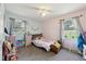 Cozy bedroom featuring carpet, natural light, ceiling fan and soft pink and blue walls at 419 Fincher Rd, Covington, GA 30016