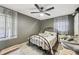 Cozy bedroom featuring a ceiling fan and two windows providing ample natural light at 419 Fincher Rd, Covington, GA 30016