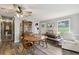 Inviting dining area featuring hardwood flooring, an antique hutch and views of the lawn outside at 419 Fincher Rd, Covington, GA 30016