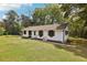 Angled exterior view of a one-story home on a large lot with an inviting entry at 419 Fincher Rd, Covington, GA 30016
