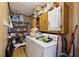 Laundry room with washer, dryer, and shelving for storage at 419 Fincher Rd, Covington, GA 30016
