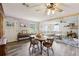 Inviting dining and living room featuring an open-concept design and hardwood flooring at 419 Fincher Rd, Covington, GA 30016