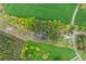 Overhead shot of property displaying the house, surrounding trees, and large lot with private pond at 190 Ccc Rd, Kingston, GA 30145