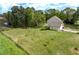 Aerial view of the property showcasing the house, large lot, landscaping, and surrounding greenery at 190 Ccc Rd, Kingston, GA 30145