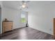 Neutral bedroom featuring modern ceiling fan and a window with view of the outdoors at 190 Ccc Rd, Kingston, GA 30145