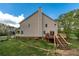 Exterior of home featuring a backyard deck, stairs, and a grassy lawn at 190 Ccc Rd, Kingston, GA 30145