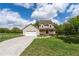 Charming two-story home featuring a covered front porch, attached garage, and a well-maintained lawn at 190 Ccc Rd, Kingston, GA 30145