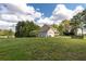 Charming home exterior with attached garage, well-manicured lawn, and a view of the spacious yard at 190 Ccc Rd, Kingston, GA 30145