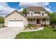 Charming home with a well-maintained front lawn, a front porch, and attached two car garage at 190 Ccc Rd, Kingston, GA 30145