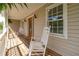 Inviting front porch with rocking chairs, offering a relaxing outdoor space for enjoying the neighborhood views at 190 Ccc Rd, Kingston, GA 30145