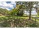 View of sprawling front yard with large trees and grass, creating a serene and inviting outdoor space at 190 Ccc Rd, Kingston, GA 30145