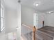 Upstairs hallway features modern flooring and neutral wall colors at 190 Ccc Rd, Kingston, GA 30145