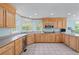The kitchen is equipped with stainless steel appliances, solid surface counter tops, and tile floors at 190 Ccc Rd, Kingston, GA 30145