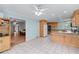 Bright kitchen features white tile floors, wooden cabinetry, and stainless steel appliances at 190 Ccc Rd, Kingston, GA 30145