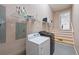 Functional laundry room with washer, dryer, and shelving for storage at 190 Ccc Rd, Kingston, GA 30145