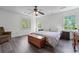 Main bedroom featuring two windows providing natural light and gray wood-look floors at 190 Ccc Rd, Kingston, GA 30145