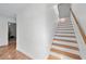 Elegant staircase with hardwood steps and white risers at 190 Ccc Rd, Kingston, GA 30145