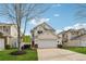 Charming two-story home featuring a two-car garage, manicured landscaping, and vinyl siding at 230 Silver Fox Trl, Dallas, GA 30157