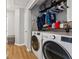 Convenient laundry room with washer, dryer and shelving for storage at 230 Silver Fox Trl, Dallas, GA 30157