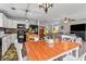 Open kitchen and living room area with dining table and backyard views at 230 Silver Fox Trl, Dallas, GA 30157