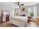 A main bedroom with a fan and two windows allowing natural light at 230 Silver Fox Trl, Dallas, GA 30157
