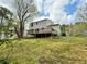 View of home with deck, overlooking the expansive back yard at 3150 Berkshire Manor Dr, Alpharetta, GA 30022