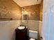 Charming powder room with decorative wallpaper and vessel sink on vanity at 3150 Berkshire Manor Dr, Alpharetta, GA 30022